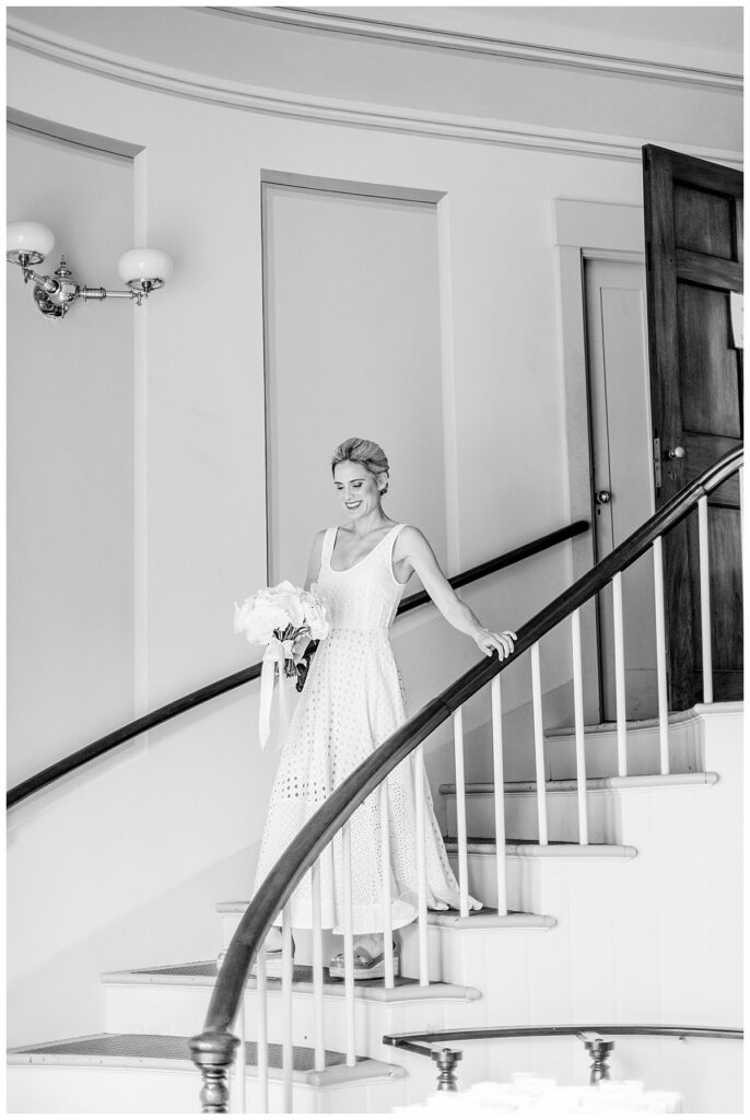 Bride walking down stairwell at Unitarian Church in Nantucket.