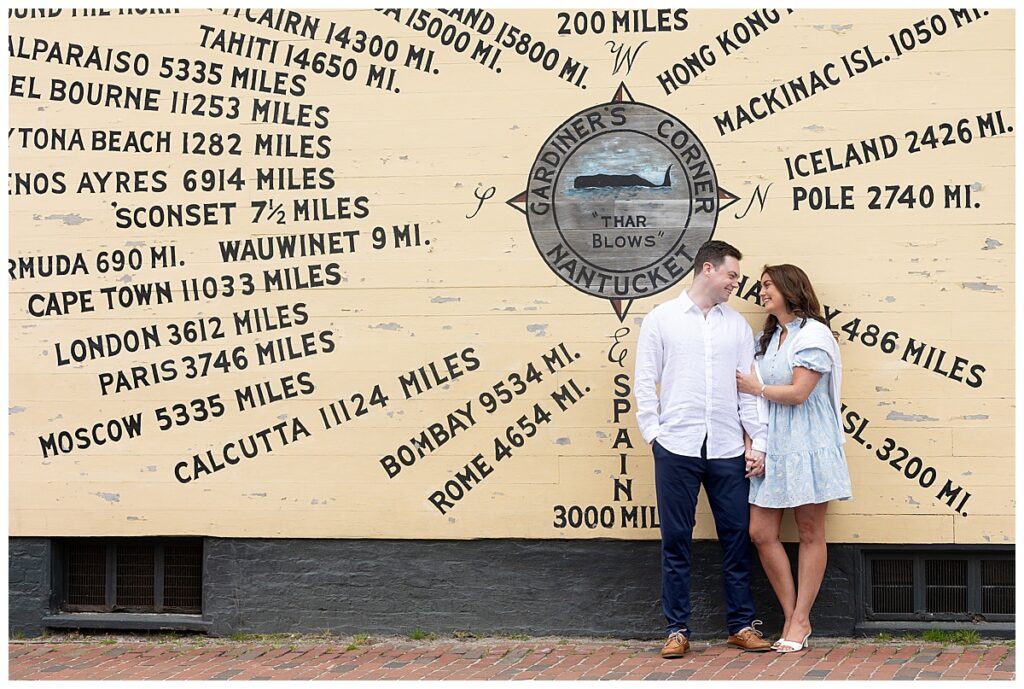 Couple takes engagement pictures next to the Nantucket compass downtown.