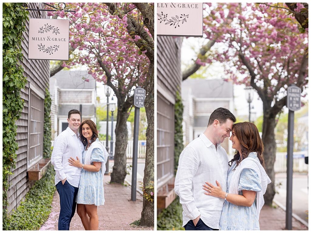 Couple face one another during an embrace under a pink blooming tree in Nantucket on a beautiful spring day taking engagement pictures.
