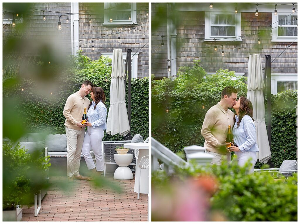 Couple share a kiss in Nantucket while having engagement pictures taken in Nantucket.