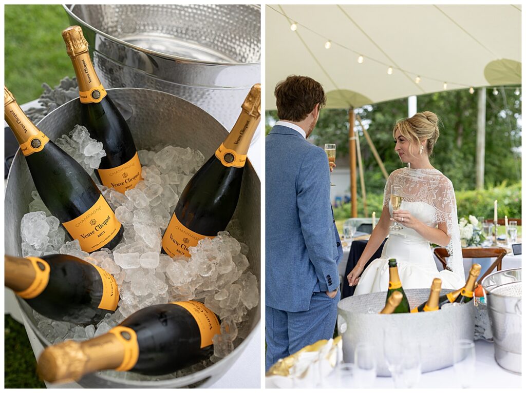 Bride and Groom drink champagne under a tent with string lights, at their Chatham, Cape Cod wedding.