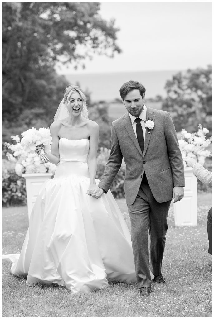 Bride and Groom smile in excitement after being pronounced husband and wife at their Chatham, Cape Cod wedding.