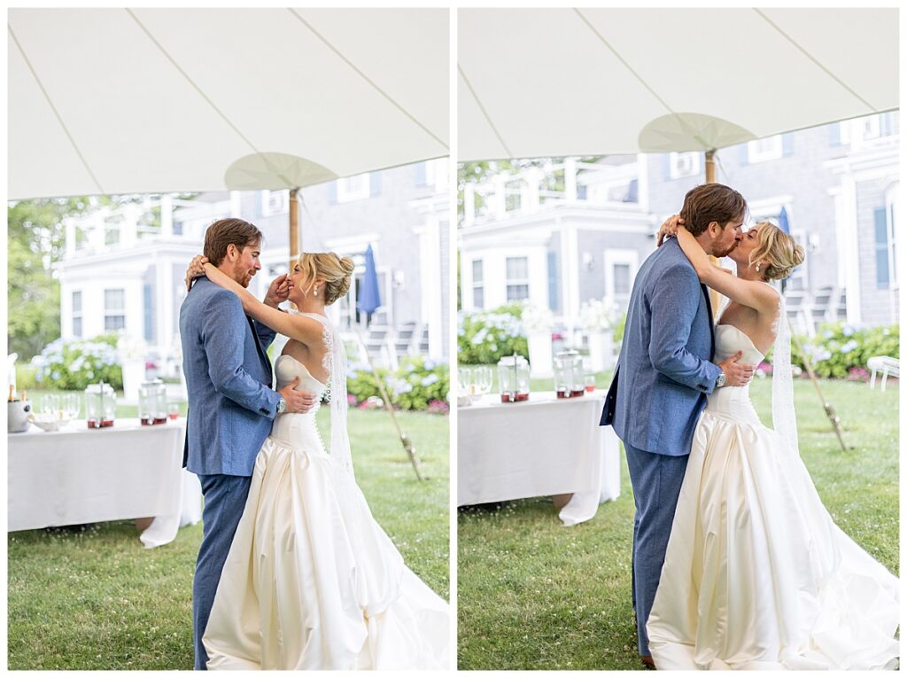 Groom wipes a tear away from bride's face as they happily dance their first dance at their wedding in Chatham, Cape Cod, Massachusetts.