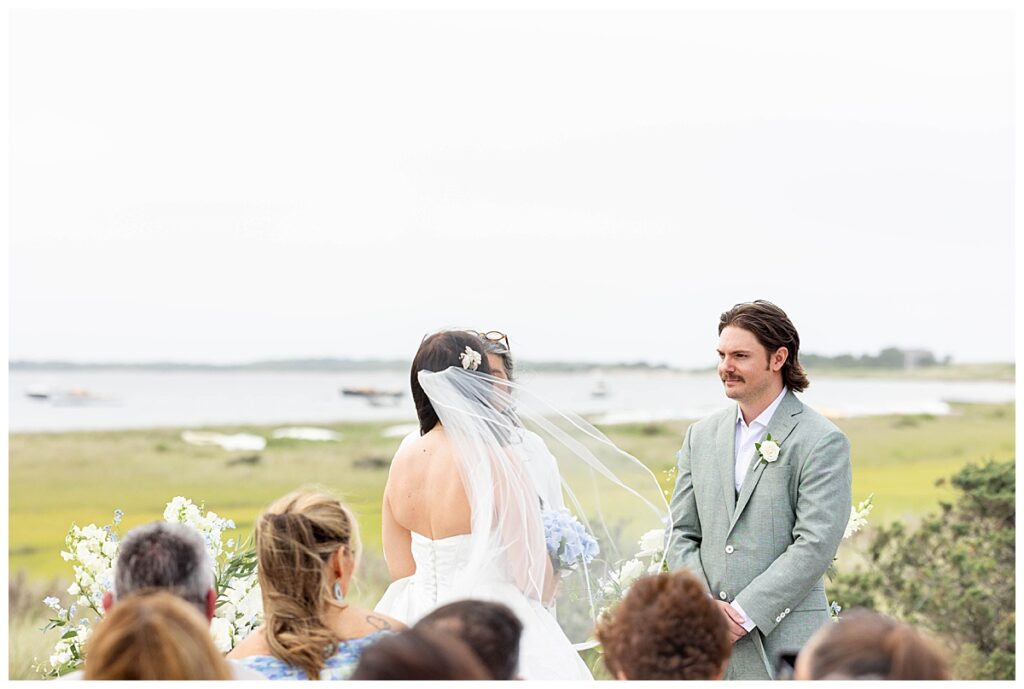 Groom looking lovingly at his bride on the Zen Deck at the Wauwinet in Nantucket.
