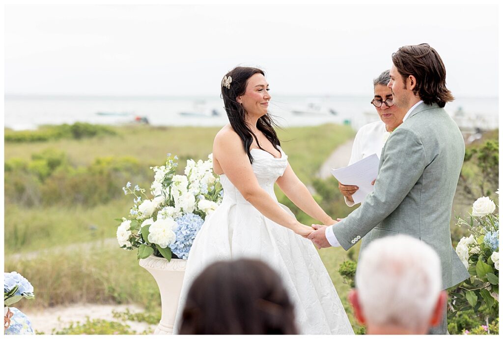 Bride smiling at her husband on the Zen Deck at The Wauwinet in Nantucket.