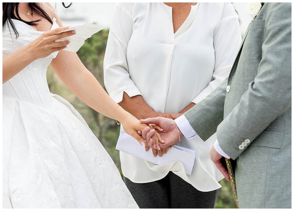 Bride and Groom holding hands on the Zen Deck at The Wauwinet in Nantucket at their wedding.