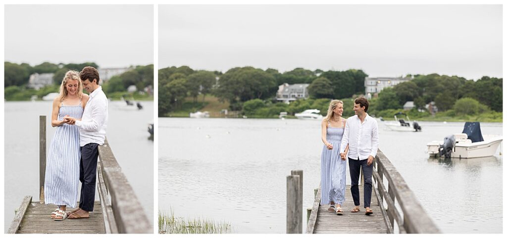 Man and woman look at ring and smile in happiness while standing by the dock in Chatham, Cape Cod, Massachusetts.