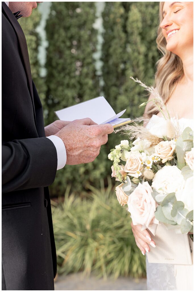 Bride and Groom exchange vows during a First Look at their wedding at The Lakehouse, a Sapphire Event Group venue in Halifax, Cape Cod, Massachusetts.