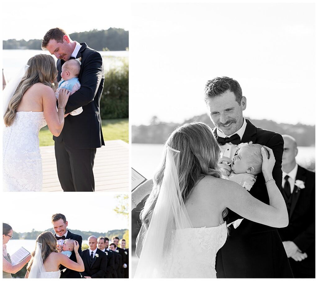 Groom smiles at his Bride and baby daughter as ceremony begins at The Lakehouse, a Sapphire Event Group venue in Halifax, Cape Cod, Massachusetts.