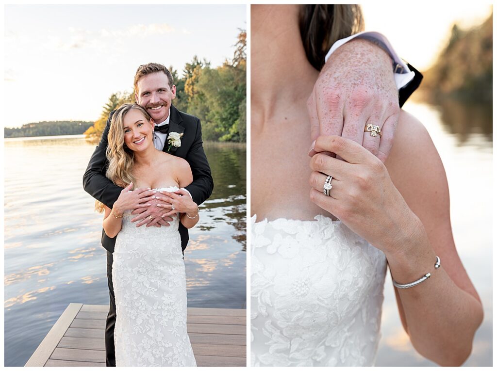 Groom hugs his bride from behind while standing on the dock of The Lakehouse, a Sapphire Event Group venue at sunset near the water.